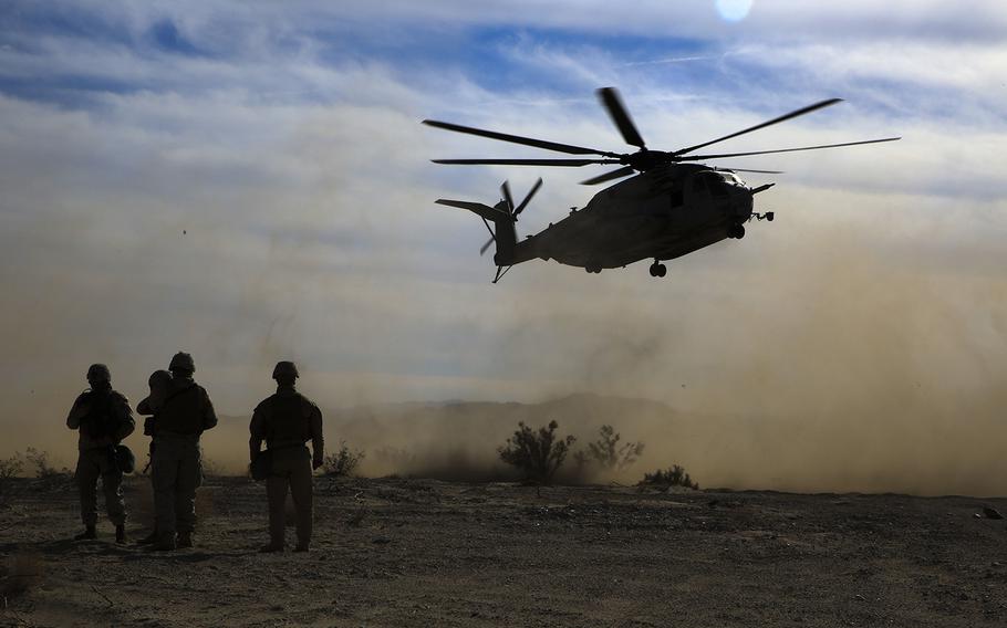 Marines radio in a simulated MEDEVAC to a CH-53E Super Stallion with Marine Heavy Helicopter Squadron 462 during Steel Knight 17 at Marine Corps Air Ground Combat Center Twentynine  Palms, Calif., Dec. 7, 2016. 