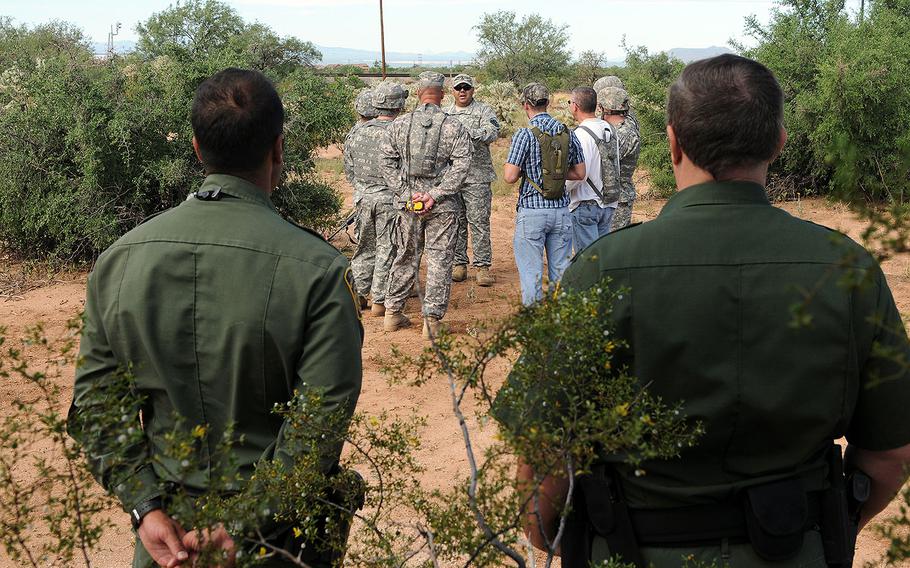 Border Patrol agents observe Arizona National Guard soldiers training at an undisclosed location in Arizona on Aug. 25, 2007. The Arizona National Guard is among the up to 1,200 troops being deployed to support Border Patrol and Immigration and Customs Enforcement int he four Southwest border states.