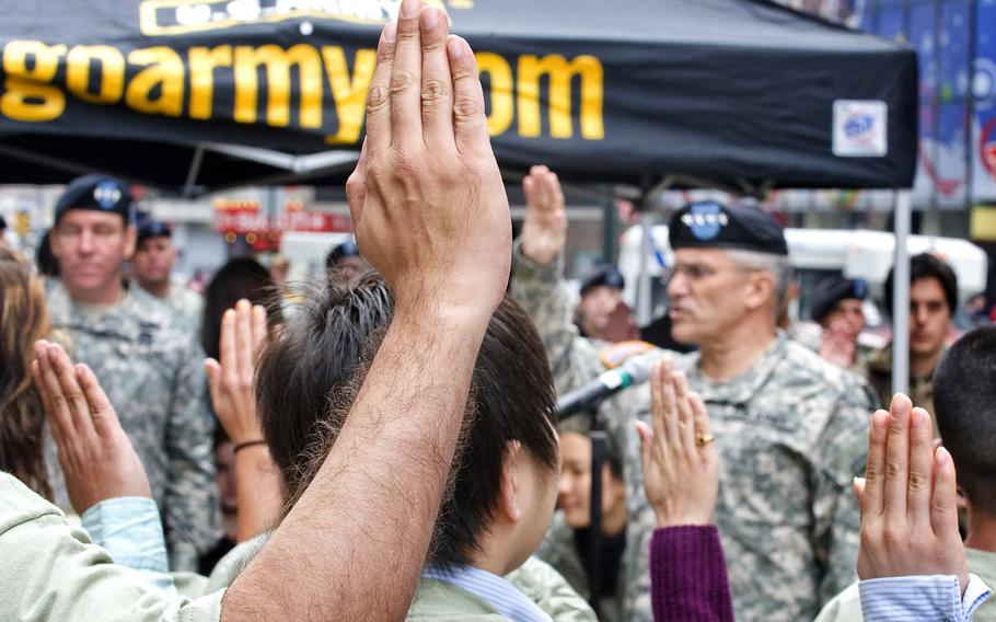 Army Gen. George W. Casey Jr., then the Army's chief of staff, administers the oath of enlistment to 26 recruits in New York City. The photo, taken in 2009, includes 16 recruits with the Military Accessions Vital to National Interest program, which enabled over 10,000 foreign-born people with special language or medical skills to enlist in the military.