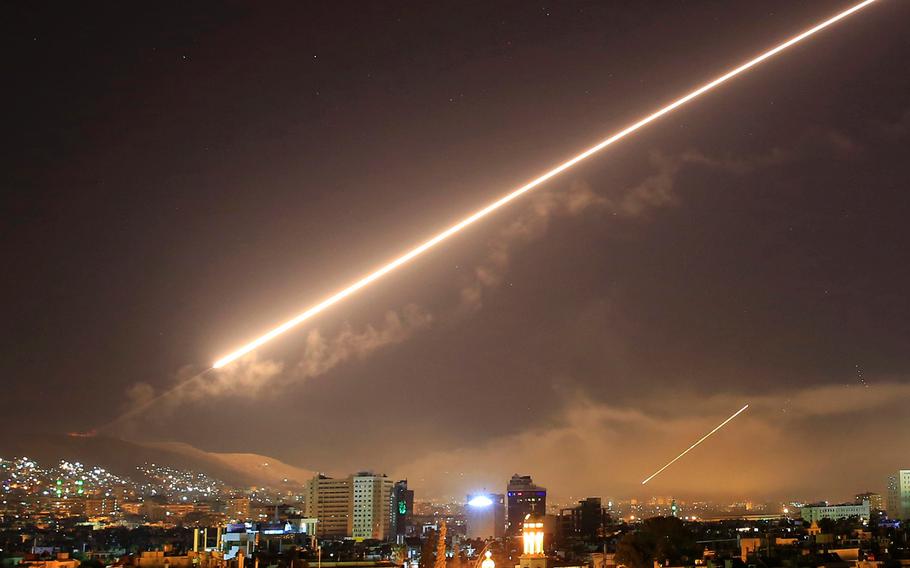 Damascus skies erupt with surface to air missile fire as the U.S. launches an attack on Syria targeting different parts of the Syrian capital Damascus, Syria, early Saturday, April 14, 2018. 