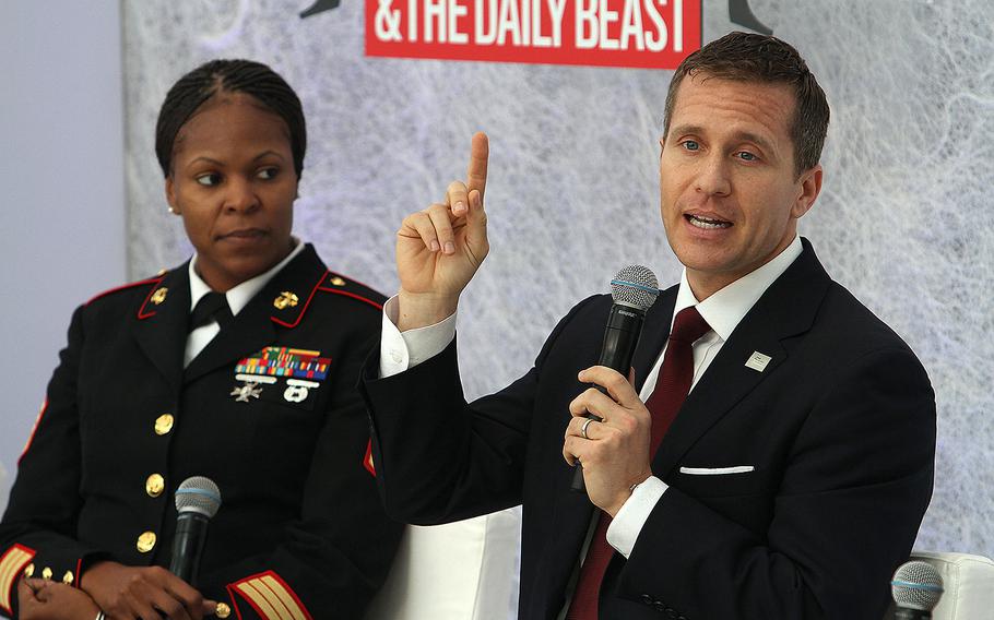Eric Greitens, a U.S. Navy veteran and chief executive officer of The Mission Continues, explains to the audience at the Hero Summit in Washington, D.C., Nov. 15, 2012, how he was motivated to join the military after graduating from Oxford University.