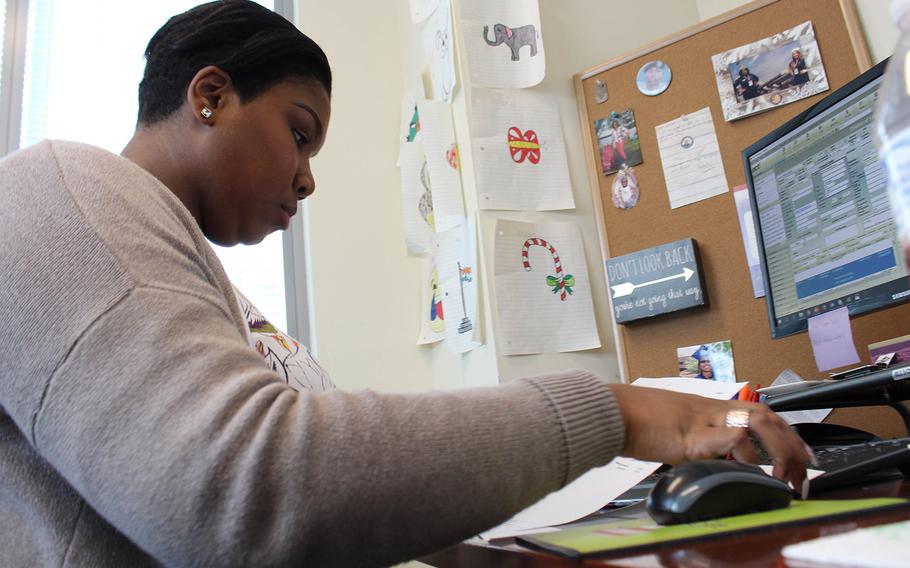 Jervon Lemon works at her desk at Children of the Fallen Patriot Foundation in Reston, VA. Lemon received a college scholarship recipient through the foundation, and is now ae scholarship administrator there.