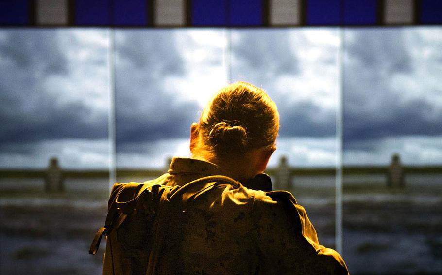 A Marine practices marksmanship techniques at Camp Geiger, N.C., Sept. 26, 2013. 
