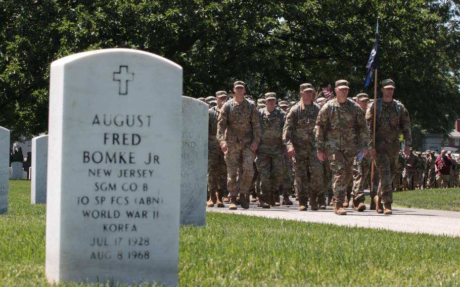 The U.S. Army's 3rd Infantry Regiment, better known as The Old Guard, march on to Arlington National Cemetery on May 24, 2018, to place flags at graves throughout the cemetery ahead of Memorial Day weekend. 