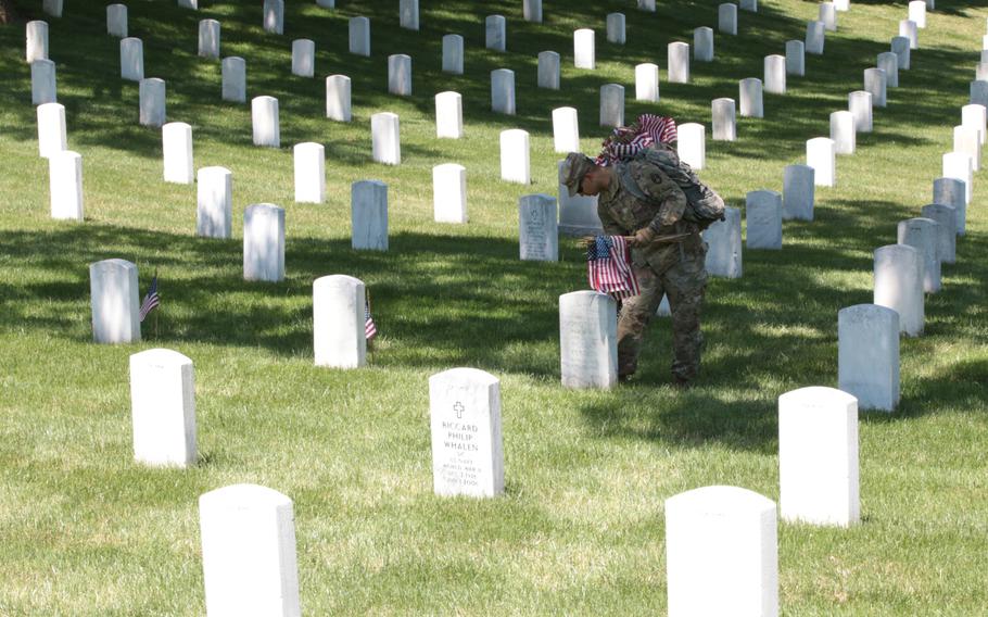 The U.S. Army's 3rd Infantry Regiment, better known as The Old Guard, march on to Arlington National Cemetery on May 24, 2018, to place flags at graves throughout the cemetery ahead of Memorial Day weekend. 