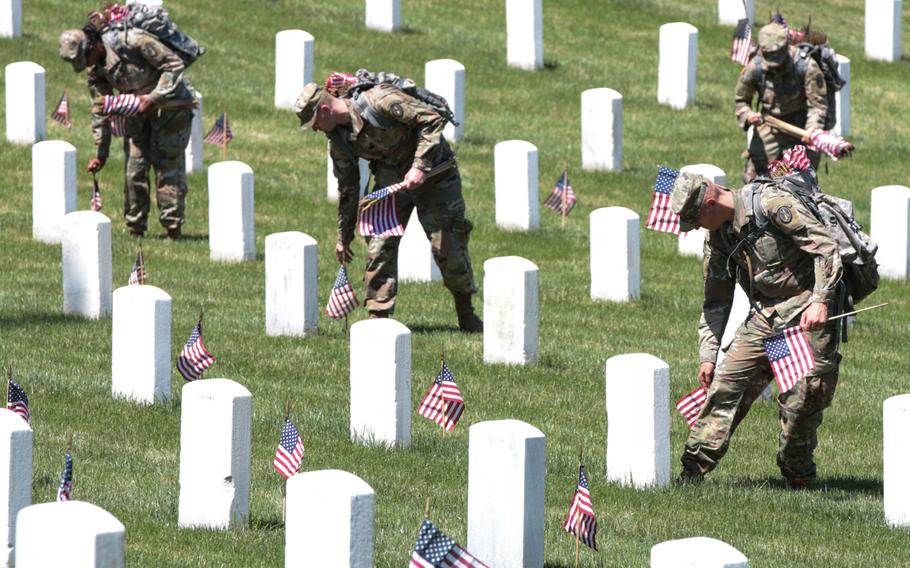 The U.S. Army's 3rd Infantry Regiment placed more than 200,000 flags on May 24, 2018, at gravesites throughout Arlington National Cemetery ahead of Memorial Day weekend.
