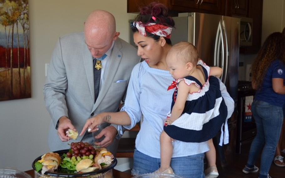 Ty Carter, girlfriend Jennifer Aedo and their 14-month-old daughter Eve get lunch following an unveiling celebration of Carter’s new home in Bastrop, Texas on June 14, 2018. The Texas Sentinels Foundation donated the home to Carter, a former Army staff sergeant and recipient of the Medal of Honor. 