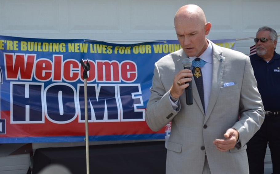 Medal of Honor recipient Ty Carter addresses a crowd of about 150 people during the unveiling of his new home in Bastrop, Texas, on June 14, 2018. It was built and donated debt-free by the Texas Sentinels Foundation. 