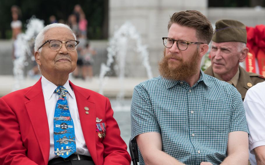 Tuskegee Airman Charles McGee and Washington Nationals pitcher Sean Doolittle listen during the ceremony to honor the 75th anniversary of the Battle for the Skies, the air war during WWII. 
