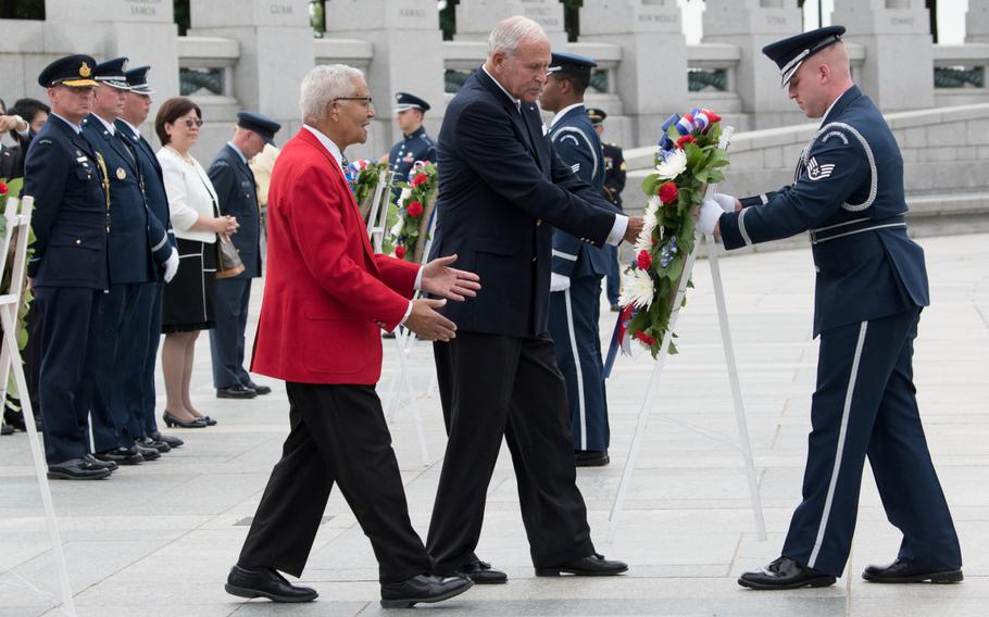 Veteran of the Tuskegee Airmen Charles McGee places a wreath at the National World War II Memorial with Josiah Bunting III, chairman of the memorial, on June 20. 