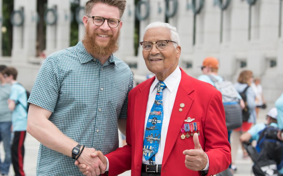 Washington Nationals pitcher Sean Doolittle shakes hands with Tuskegee Airman Charles McGee. Both were in attendance at the National World War II Memorial on June 20 for a ceremony commemorating the veterans of the Battle for the Skies, the air war during WWII. 
