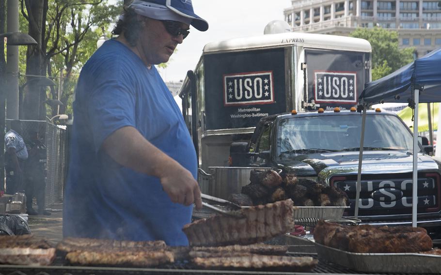 Stratford University culinary instructor John Oravec bbq's some pork tenderloins at the Military Cook-Off at the 2018 Giant National Capital Barbecue Battle, Sunday, June 24, 2018. Oravec's father served in the Army for 20 years. 