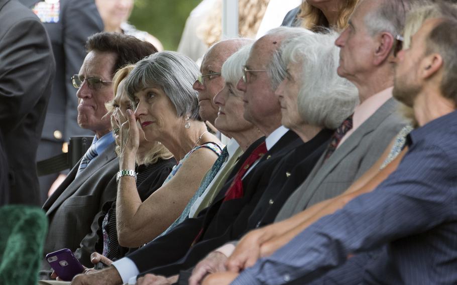 Friends and family members of five airmen killed during World War II attend their joint funeral at Arlington National Cemetery on June 27, 2018.