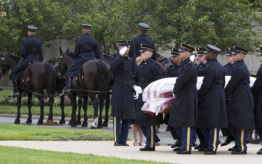 A flag-draped coffin carries the commingled remains of five World War II airmen who died during a mission in Germany in 1944. They were buried together at Arlington National Cemetery on June 27, 2018.

