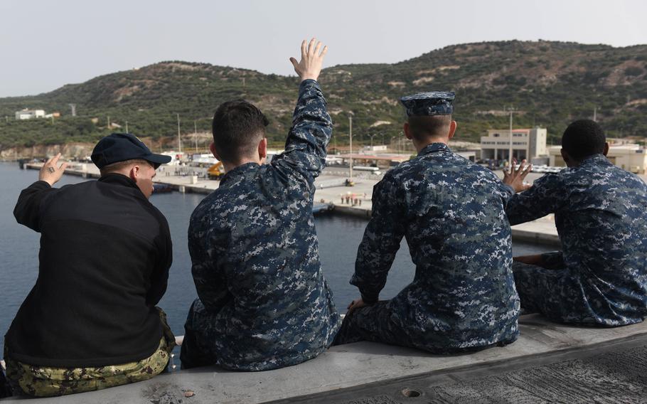 Sailors observe Souda Bay, Crete from the flight deck aboard the Nimitz-class aircraft carrier USS Harry S. Truman on May 23, 2018. The Navy announced Thursday that it will begin requiring enlisted sailors to transfer from shore duty to sea billets where the need is critical.