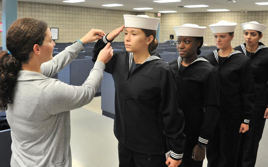 Female Navy recruits are fitted by Navy Exchange Uniform Issue employees at Recruit Training Command. Women in the Navy will soon have more hairstyle options while in uniform, according to an announcement about upcoming changes to female grooming standards.