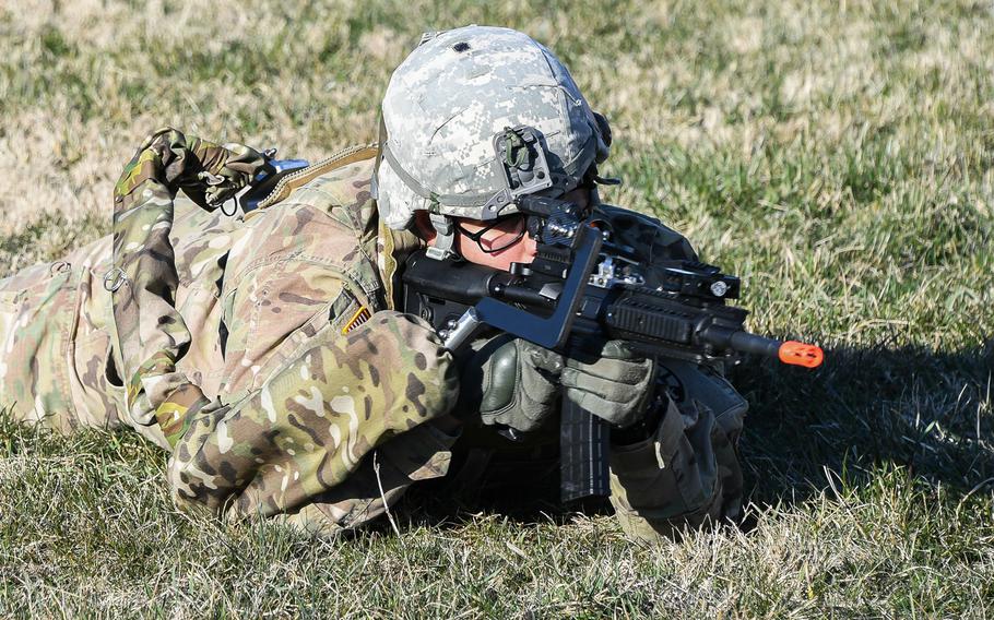 Army Sgt. Michael Zamora assumes a prone fighting position using a prototype Third Arm exoskeleton device during testing at Aberdeen Proving Ground, Maryland, March 14, 2018.