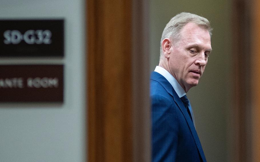 Acting Secretary of Defense Patrick Shanahan looks over his shoulder as he arrives for a Senate Armed Services Committee hearing on Capitol Hill in Washington on Thursday, March 14, 2019.