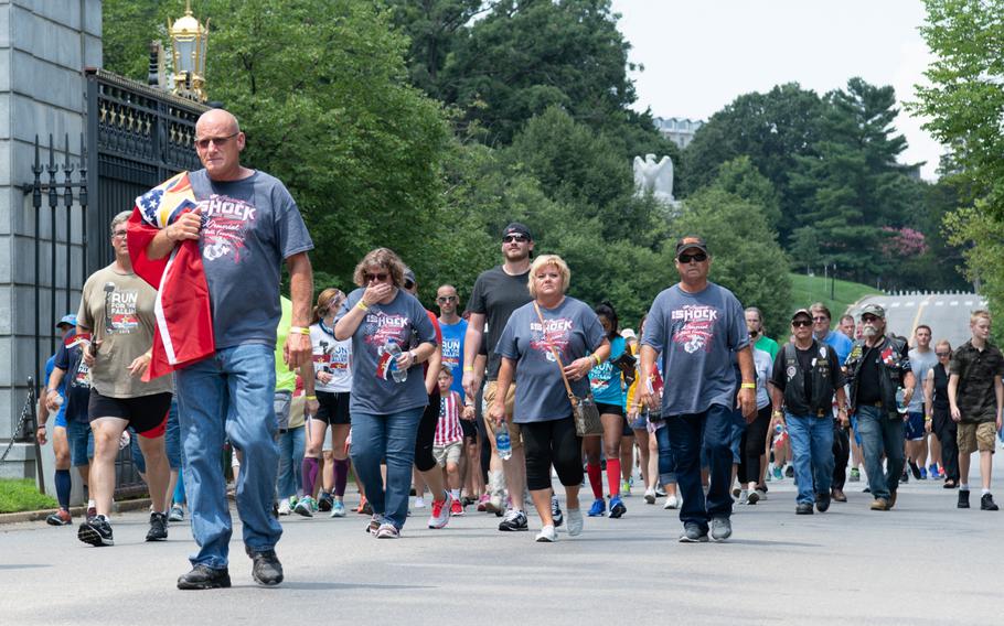 Gold Star families, servicemembers and supporters walk the final mile of the Run for the Fallen at Arlington National Cemetery in Virginia on Aug. 5, 2018. The Run for the Fallen traversed 19 states over 5 months, over a route that covered almost 6,000 miles. Each mile honored fallen American servicemembers. 