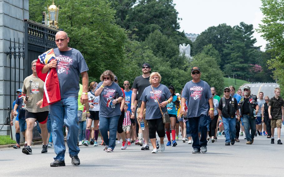 Gold Star families, servicemembers and supporters walk the final mile of the Run for the Fallen at Arlington National Cemetery in Virginia on Aug. 5, 2018. The Run for the Fallen traversed 19 states over 5 months, over a route that covered almost 6,000 miles. Each mile honored fallen American servicemembers.