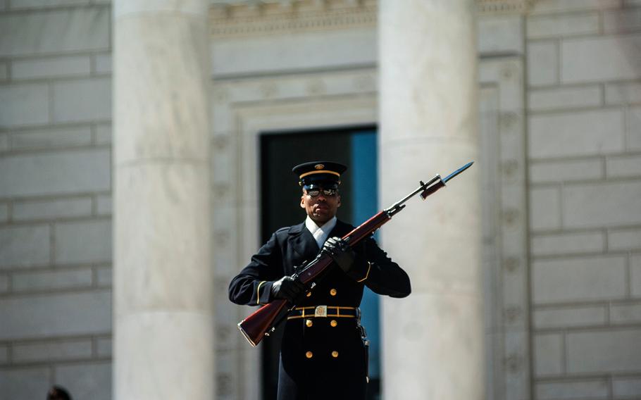 A soldier stands guard at Arlington National Cemetery's Tomb of the Unknowns on March 23, 2018. Visitors and employees at the cemetery were evacuated Wednesday, Aug. 22, 2018, because of a bomb threat.