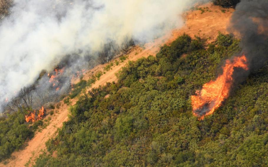 The Mendocino Complex fire in California is seen from a National Guard aircraft on Aug. 7, 2018. This fire is now about 90 percent contained.