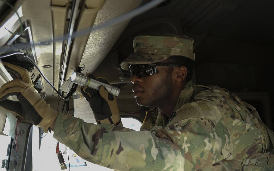 At the Texas-Mexico border-Eagle Pass point of entry, Pvt. DeVante Williams, of the 1st Battalion, 124th Calvary Regiment, of the Texas Army National Guard, takes part in Operation Guardian Support by assisting Customs and Border Protection agents with a search of an 18-wheeler's cab and load on July 11, 2018. 