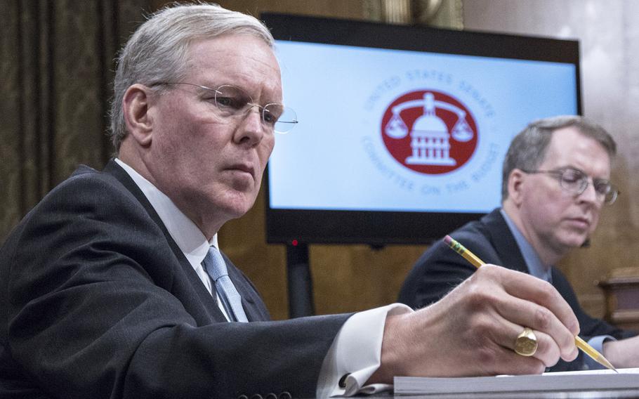 John H. Gibson II, left, the Pentagon's chief management officer, at a Senate hearing in March, 2018. At right is DOD Comptroller David Norquist.