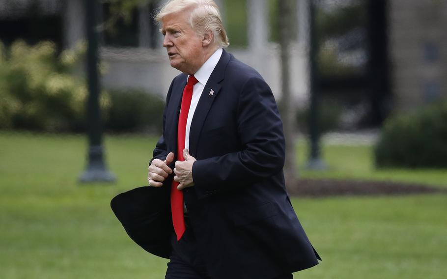 President Donald Trump walks across the South Lawn at the White House in Washington on Thursday, Sept. 27, 2018.