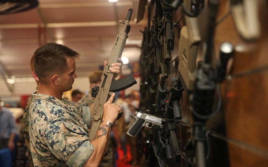 A Marine handles a weapon during the Modern Day Marine military expo at Lejeune Field, Marine Corps Base Quantico in Virginia on Sept. 25, 2018.