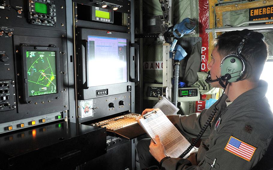 Maj. Jeremy DeHart, a 53rd Weather Reconnaissance Squadron aerial reconnaissance weather officer, reviews data prior to sending the data to the National Hurricane Center for Hurricane Michael on Oct. 10, 2018.