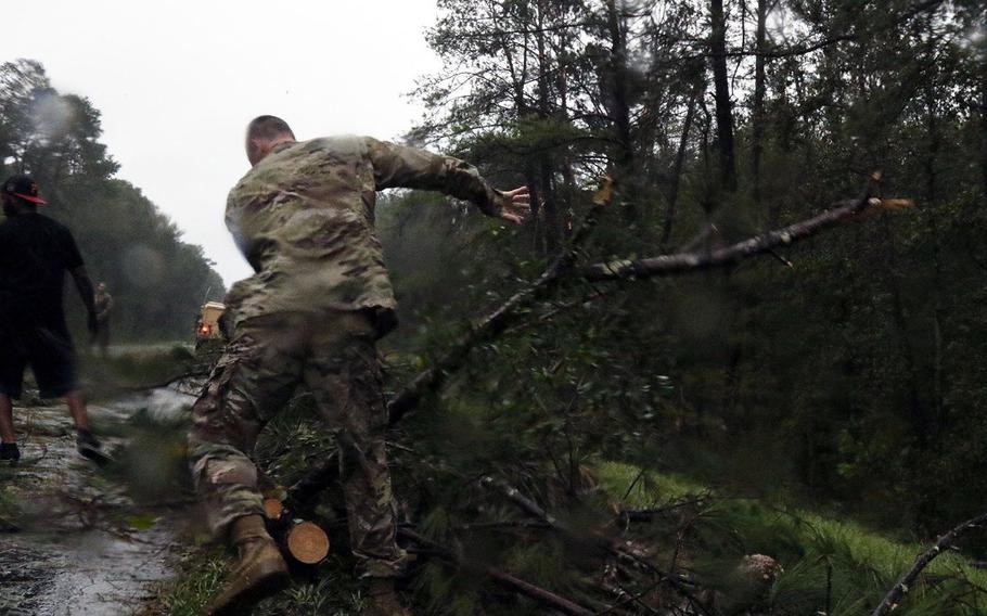 Florida National Guard soldiers help clear debris from Hurricane Michael on I-10 west on Oct. 11, 2018.