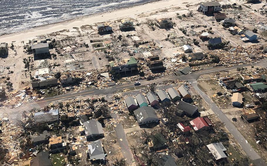 A U.S. Customs and Border Protection Office of Air and Marine A-Star Helicopter surveys the damage wrought by Hurricane Michel over Mexico Beach, Florida on Oct. 11, 2018.