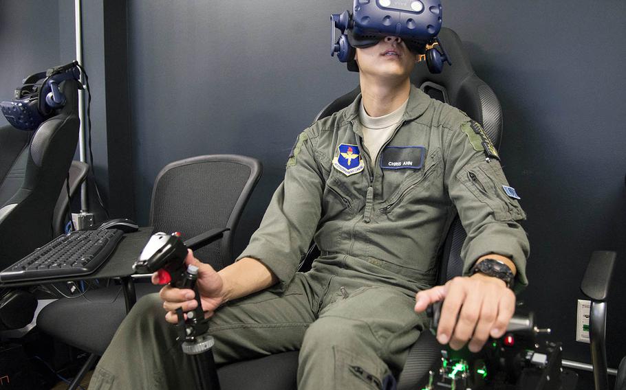 A Pilot Training Next student trains on a virtual-reality flight simulator at the Armed Forces Reserve Center in Austin, Texas, June 21, 2018. 
