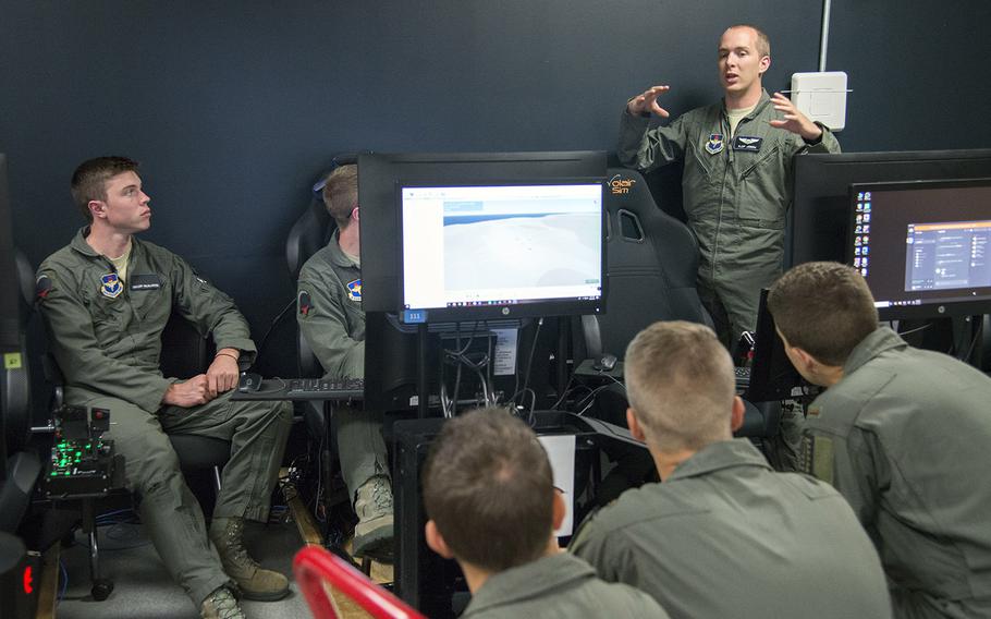 Air Force Capt. Johnathan Joern, a Pilot Training Next instructor, speaks to students about flying procedures at the Armed Forces Reserve Center in Austin, Texas, June 22, 2018. 