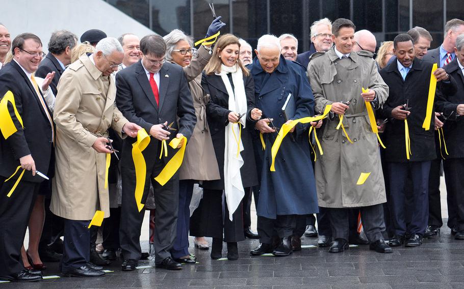 Rep. Joyce Beatty, a Democrat representing Ohio in the U.S. House, holds up her scissors in celebration during the grand opening of the National Veterans Memorial and Museum in Columbus on Saturday, Oct. 27. Beatty, along with the rest of Ohio’s congressional delegation, lobbied Congress to designate the facility a “national” site.