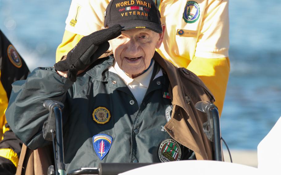 Norman Duncan, a World War II veteran, renders a salute during a wreath-laying ceremony held in honor of Veterans Day at the National World War II Memorial in Washington, D.C., on Sunday, Nov. 11, 2018. 