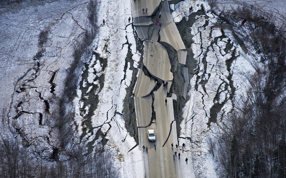 An aerial view shows damage on a road south of Wasilla, Alaska, after earthquakes Friday, Nov. 30, 2018. 