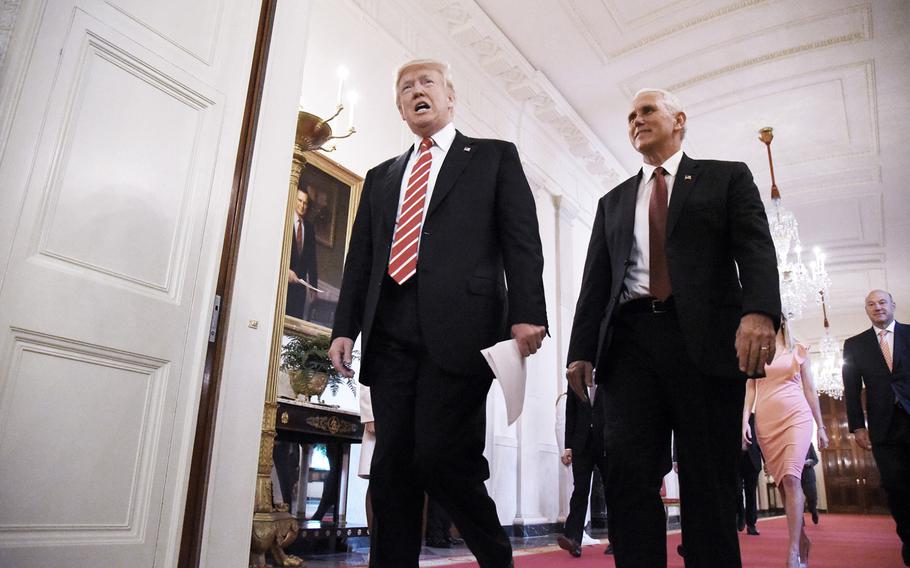 President Donald Trump and Vice President Mike Pence arrive in the East Room of the White House on June 22, 2017, in Washington, D.C.