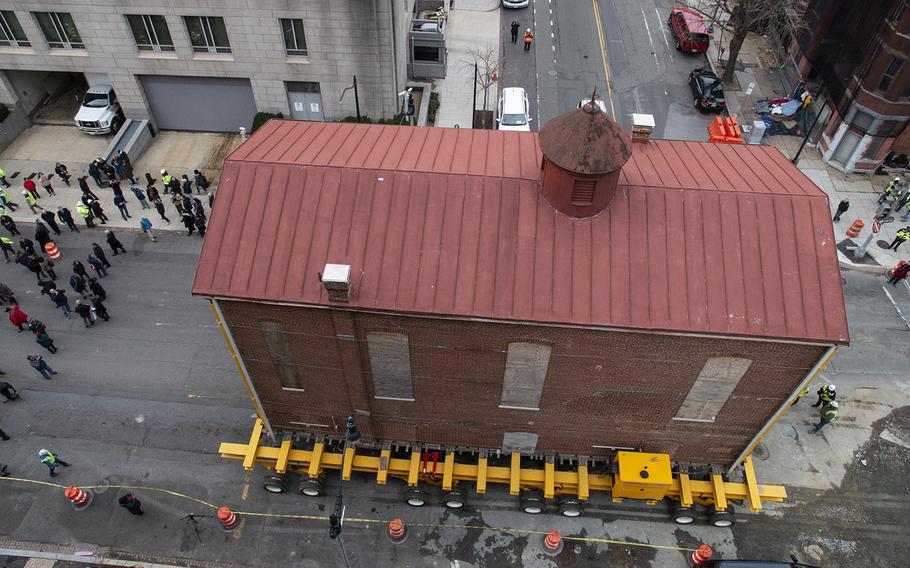 Washington's oldest synagogue building is moved down 3rd St. Northwest to its permanent location at the Lillian and Albert Small Jewish Museum site on January 9, 2019.