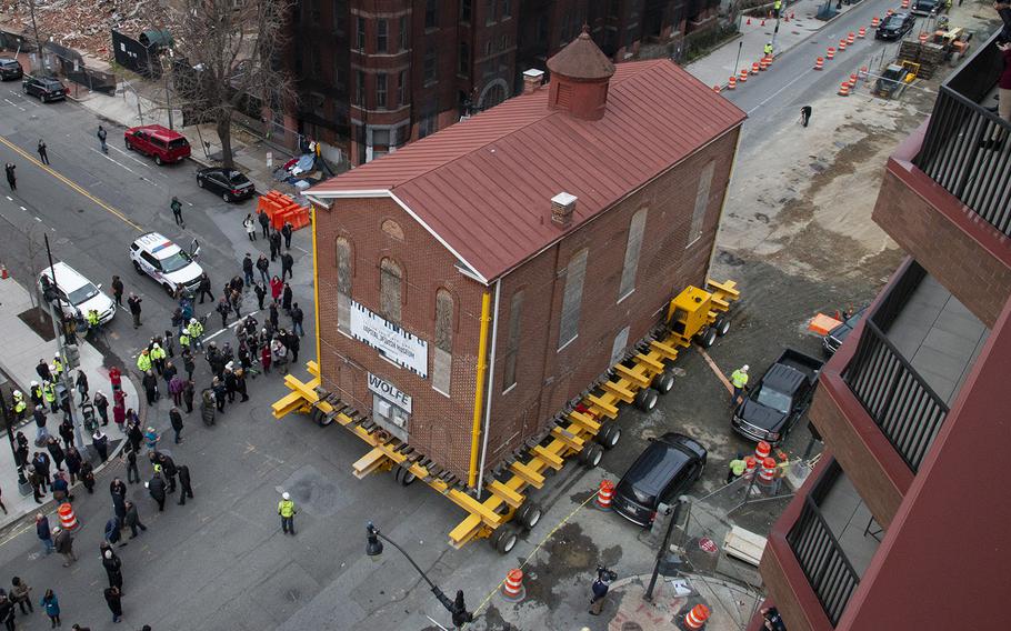 Washington's oldest synagogue building is moved down 3rd St. Northwest to its permanent location at the Lillian and Albert Small Jewish Museum site on January 9, 2019.