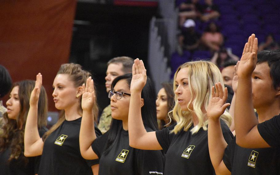 Future soldiers from the Phoenix Recruiting Battalion participate in a mass oath of enlistment ceremony on July 19, 2018,