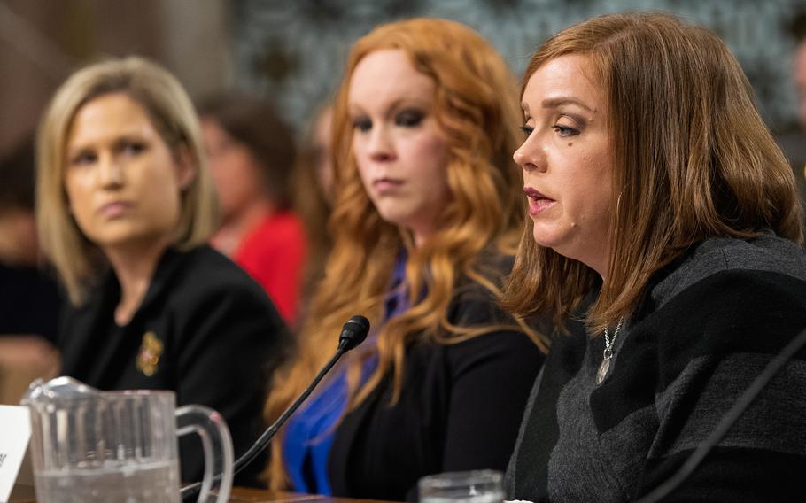 Military spouse Janna Driver testifies Wednesday, Feb. 13, 2019, during a Senate Armed Services subcommittee hearing on Capitol Hill in Washington, as fellow military spouses Crystal Cornwall, left, and Jana Wanner look on.