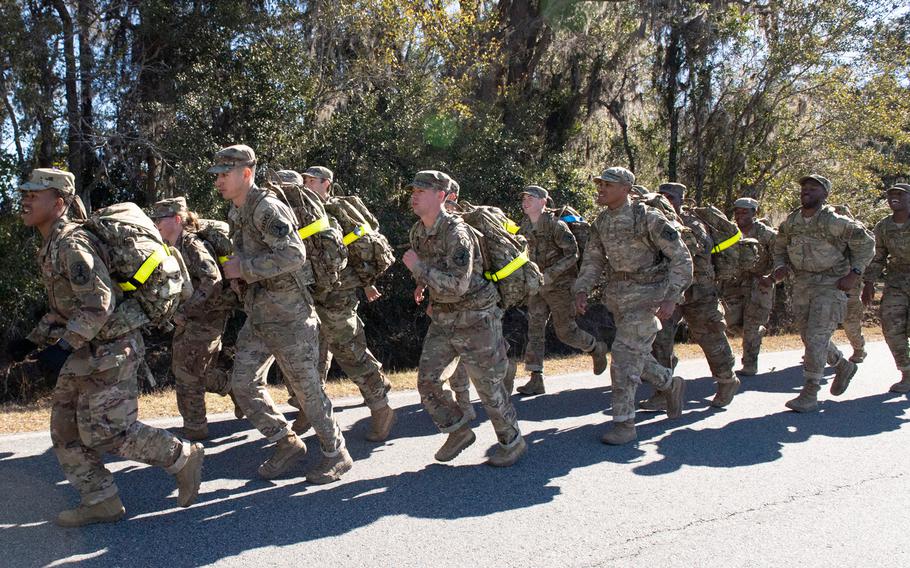 820th Base Defense Group Airmen pick up the pace during a Comprehensive Airman Fitness Day ruck march at Moody Air Force Base, Ga., Jan. 25, 2019. The formation marched three miles around the airfield to the Hoffman Auditorium, so Airmen could hear briefings from commanders and experts on physical fitness. 