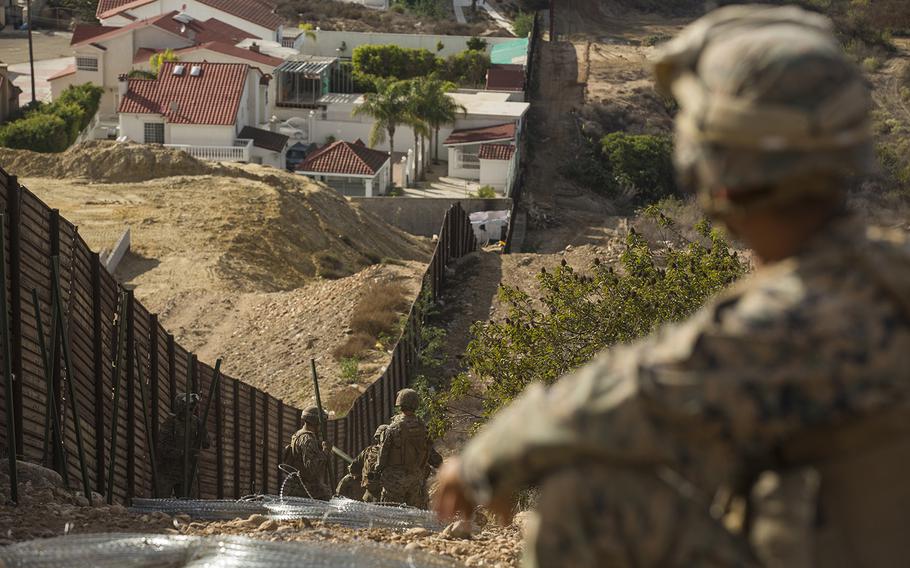 U.S. Marine Corps Sgt. Dominic Dady, a combat engineer with 1st Combat Engineer Battalion, Special Purpose Marine Air-Ground Task Force 7, supervises his team at the California-Mexico border, Nov. 28, 2018. 