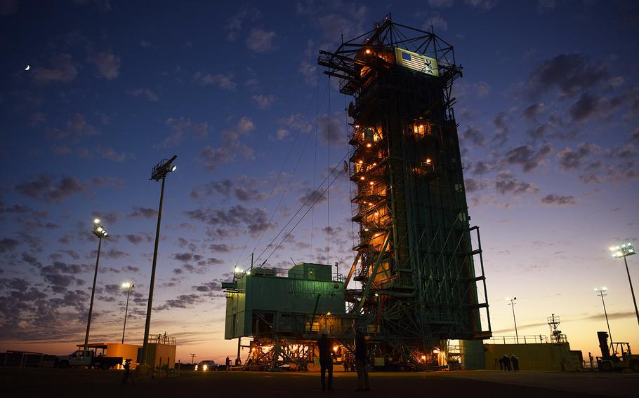 In a Sept. 14, 2018 file photo, technicians gather around Space Launch Complex Two while making preparations to launch a United Launch Alliance Delta II rocket carrying NASA's Ice, Cloud, and Land Elevation Satelite II, on Vandenberg Air Force Base, Calif.