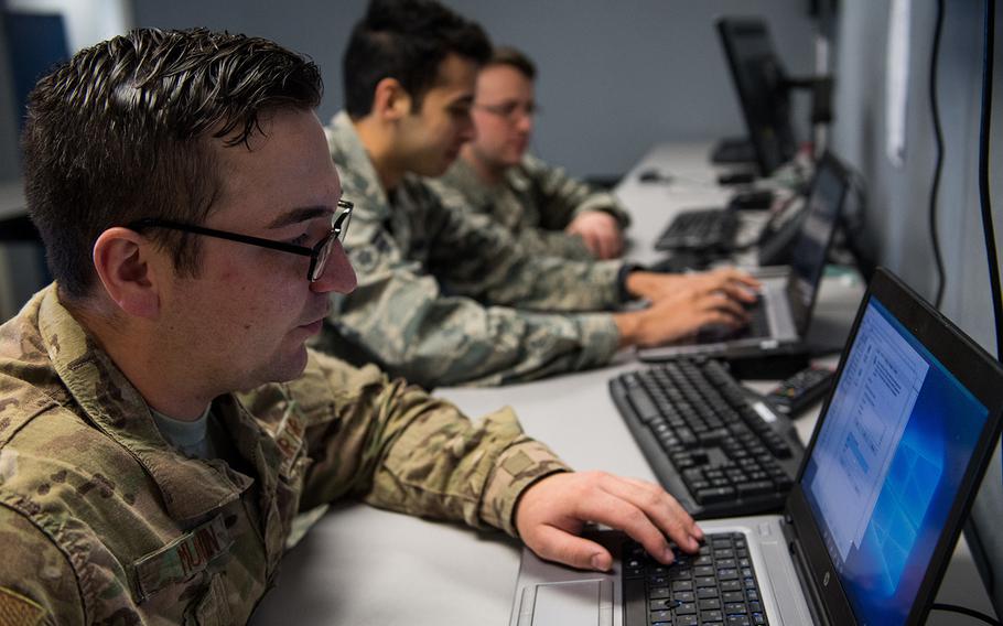 Staff Sgt. Roger Murvin troubleshoots a computer at the hub at Barksdale Air Force Base, La., Dec. 11, 2018.  Four congressmen are urging the FBI to investigate “foreign entities” believed to be targeting servicemembers and veterans online with false information.