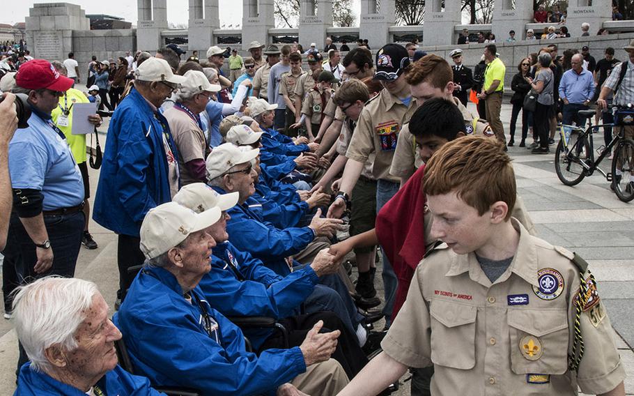 Boy Scouts shake hands with Greater St. Louis Honor Flight veterans at the National World War II Memorial in Washington, D.C., March 30, 2019.
