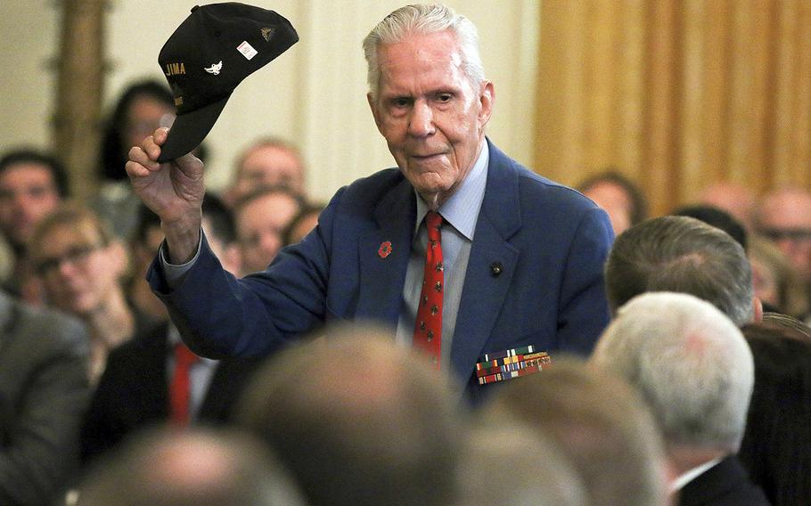 James Blane, a Marine Corps veteran who fought on Iwo Jima during the Pacific campaign of World War II, stands to applause at a White House event honoring wounded veterans, Thursday, April 18, 2019.