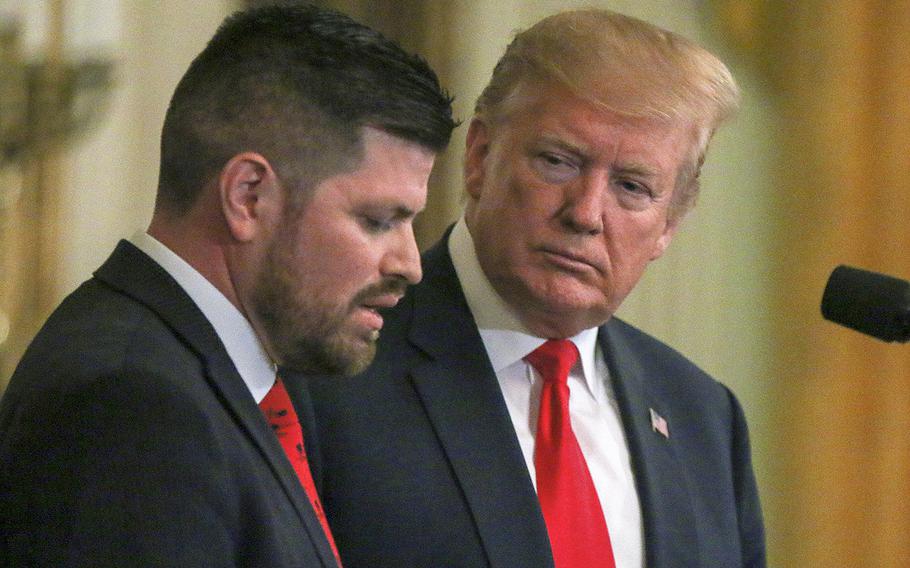 Jose Ramos, a former Navy corpsman with three combat deployments under his belt, speaks as President Donald Trump listens during a Wounded Warrior Project event held at the White House on Thursday, April 18, 2019.